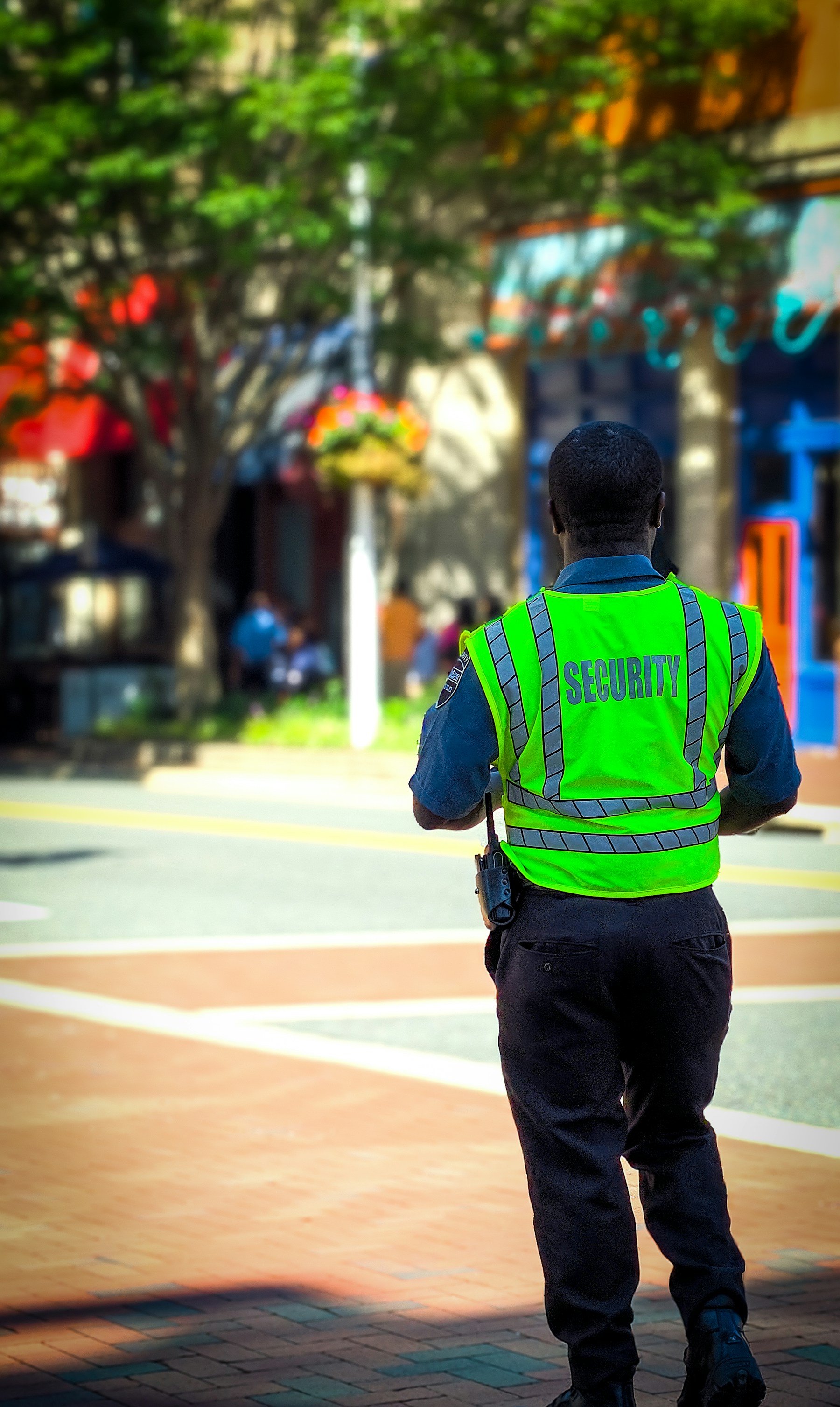 Security officer protecting a busy commercial area
