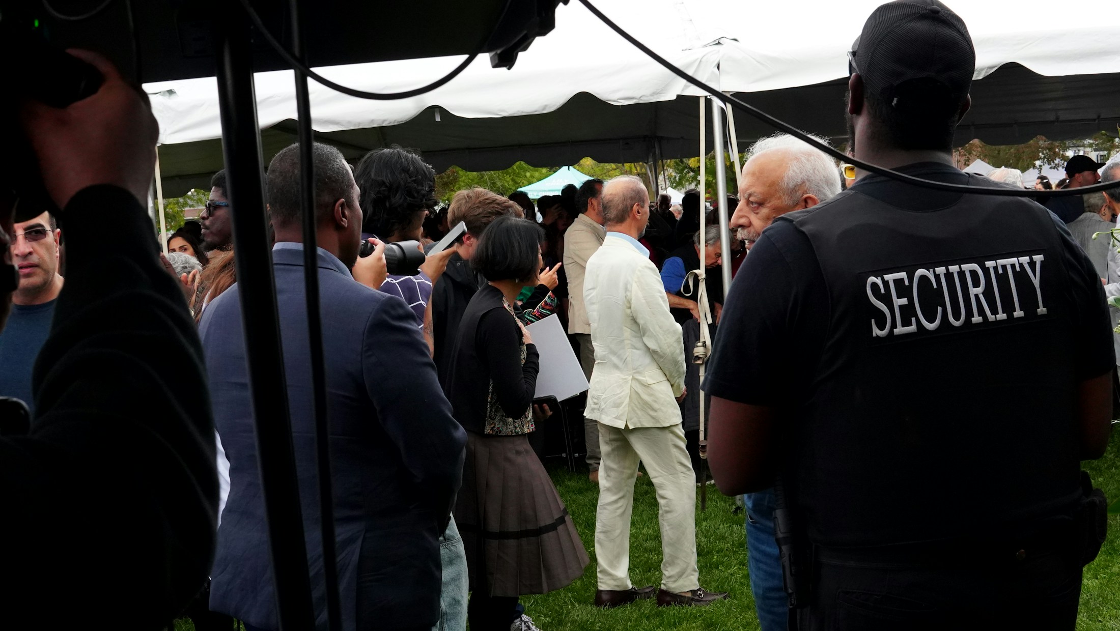 Event security officer overseeing guests at a busy public event